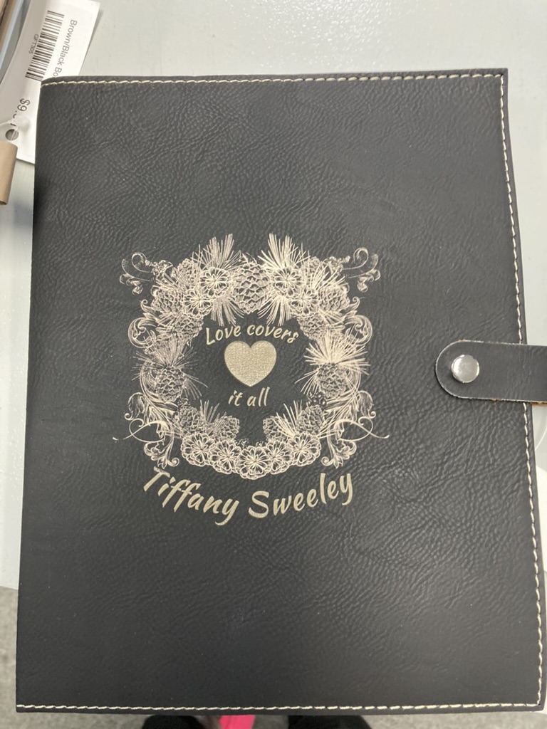Bible cover laser engraved with a floral design and a personalized name