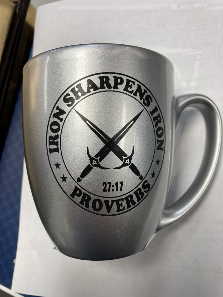 Mug laser engraved with the words Iron Sharpens Iron
