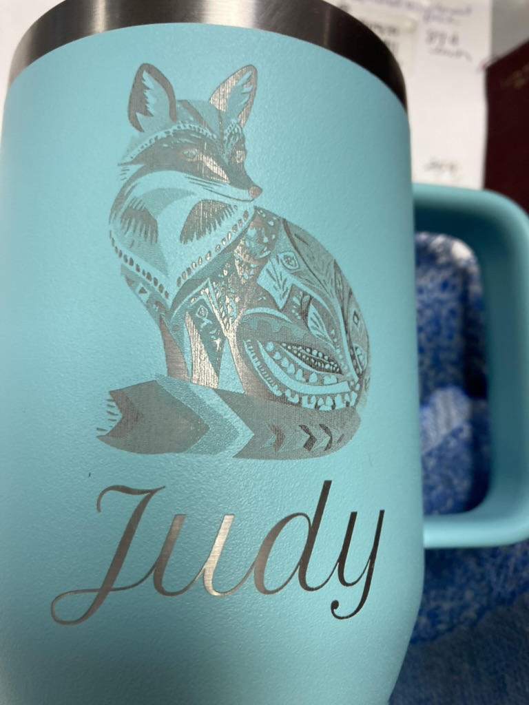 Mug laser engraved with a fox design and a personalized name